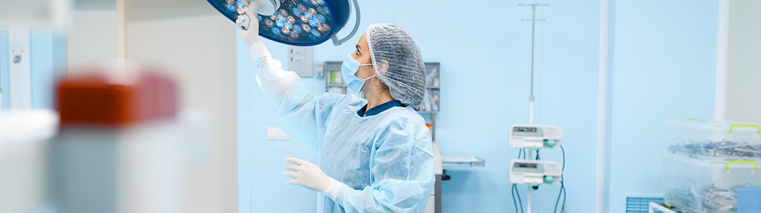 person wearing white gloves and cleaning medical machine