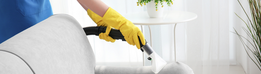 person wearing yellow latex gloves and cleaning