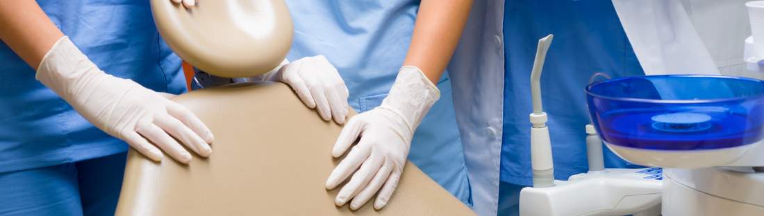 people in white latex gloves at a dental office