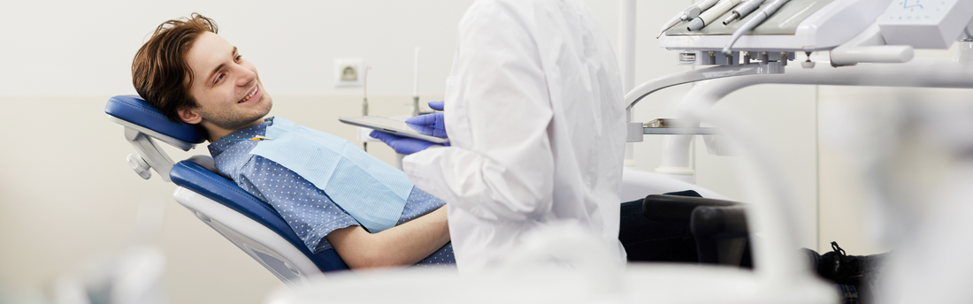 smiling patient in a dental chair