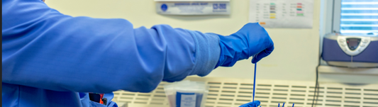 person doing lab work while wearing response ER gloves
