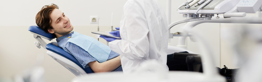 smiling patient in a dental chair