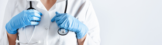 healthcare worker wearing blue nitrile gloves