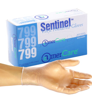Large Sentinel Powdered Vinyl Glove on a hand in front of a box of 100