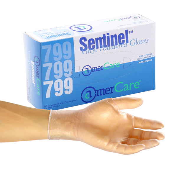Large Sentinel Powdered Vinyl Glove on a hand in front of a box of 100
